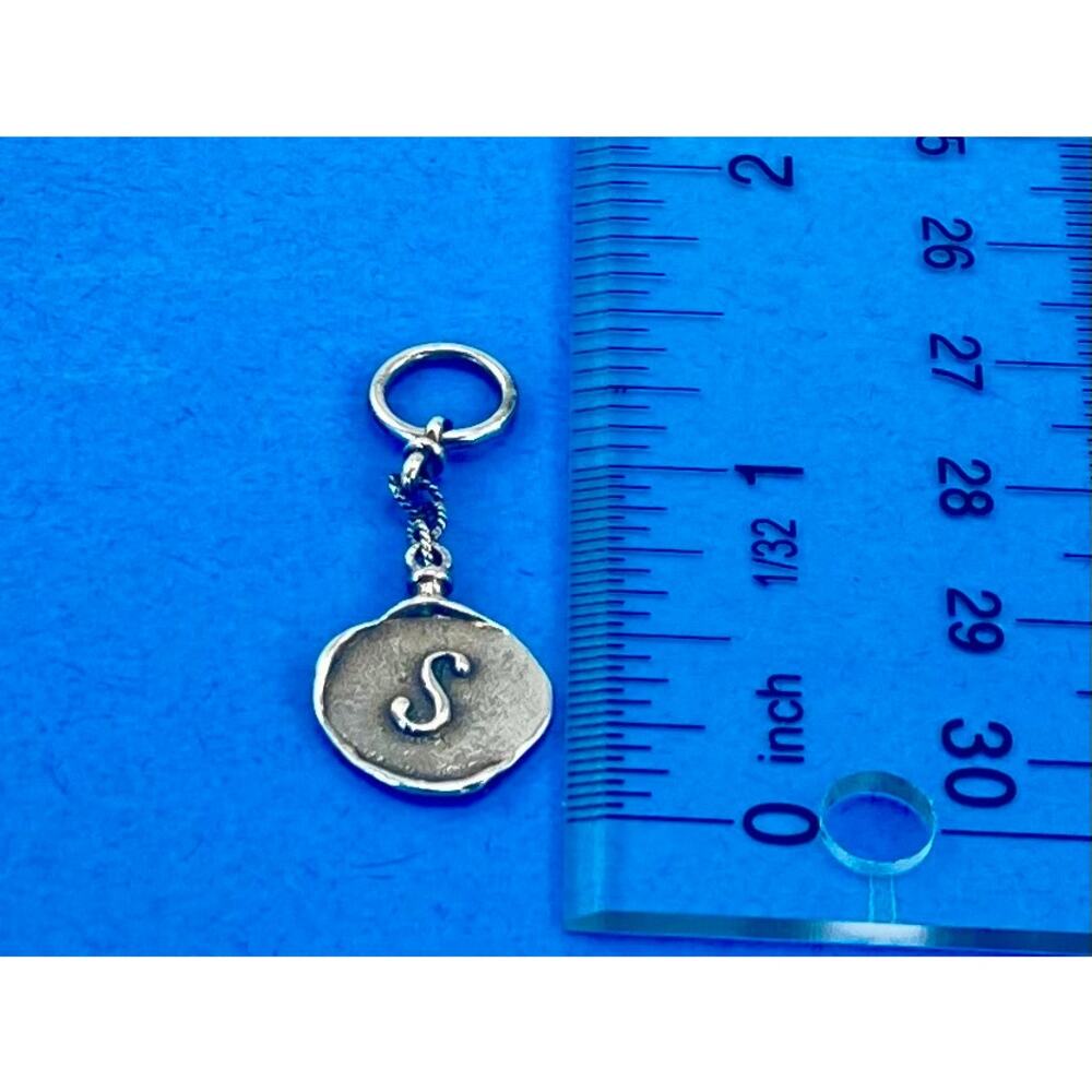 Waxing poetic Herald letter charm